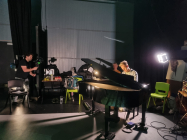 Composer David Westcott rehearsing on grand piano in the studio Pontio